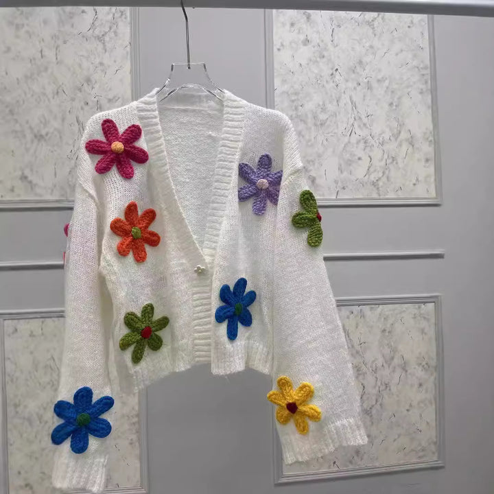 Dame strikjakke med farverigt blomsterdesign Stilla