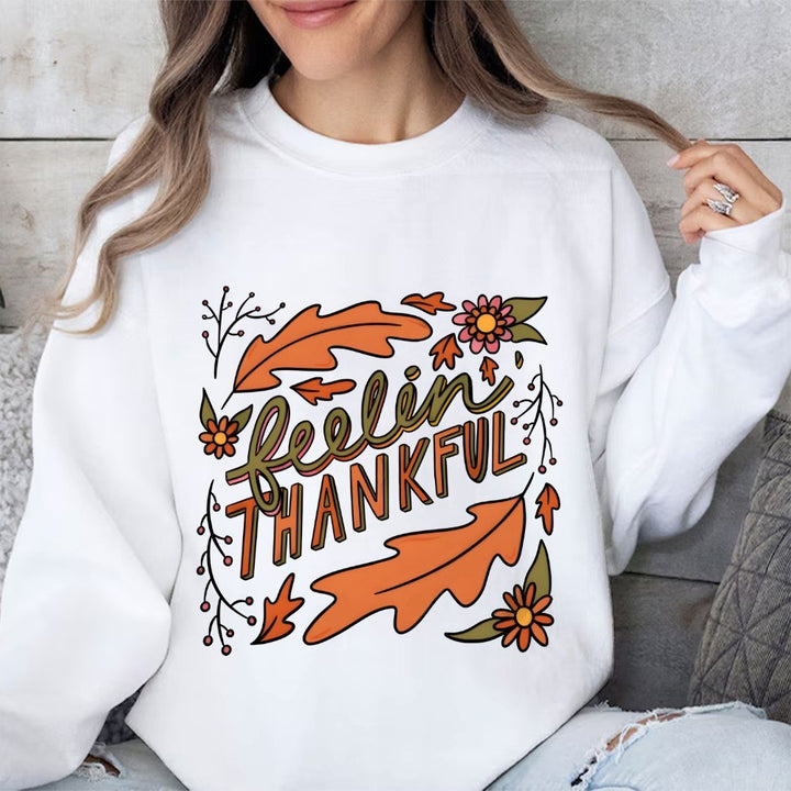 Kvinders sweatshirt med farverigt efterårsdesign og inspirerende tekst Stilla