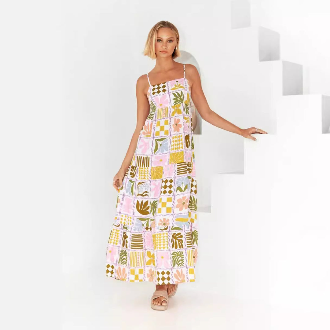 Kvindernes maxi kjole med smocked top og legende grafisk design Skovae