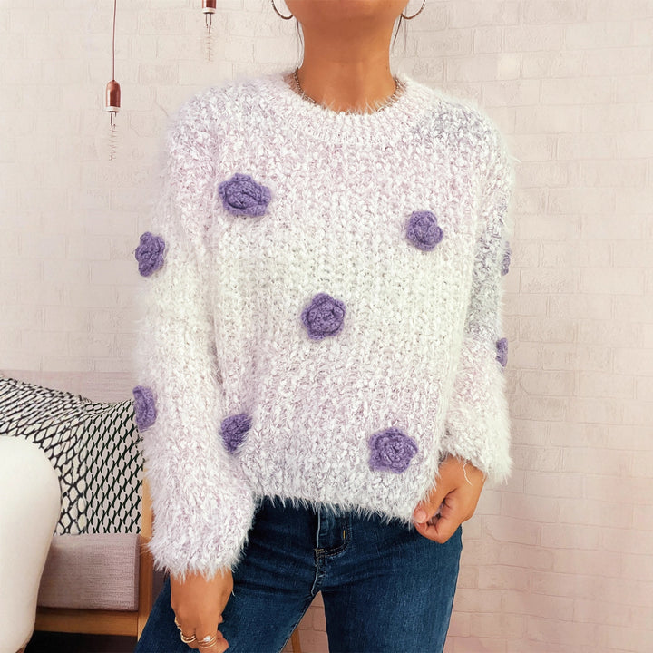 Kvindernes hyggelige strikket sweater med blomsterdetalje Stilla