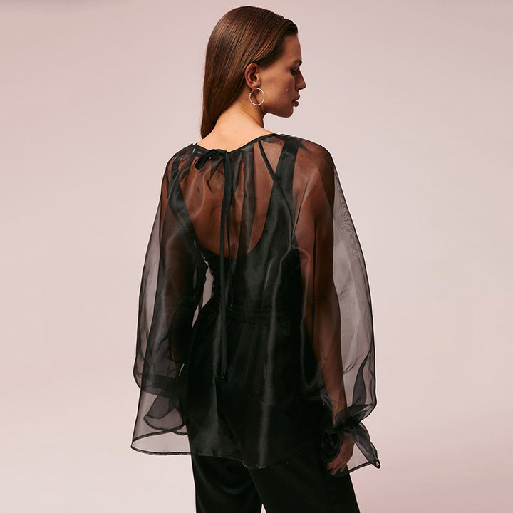 Dame gennemsigtig bluse med voluminøse ærmer og smart design Stilla