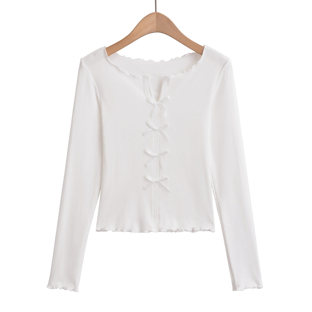 Dame elegant top med floral skæring og fine sløjfedetaljer Stilla