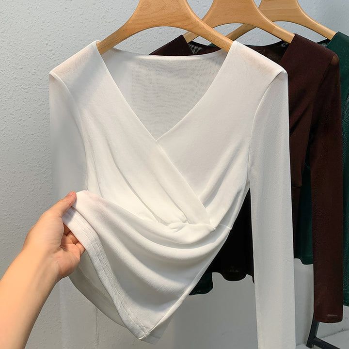 Dame elegant indpakningsbluse lavet af flydende materiale med raffinerede draperingsdetaljer Stilla
