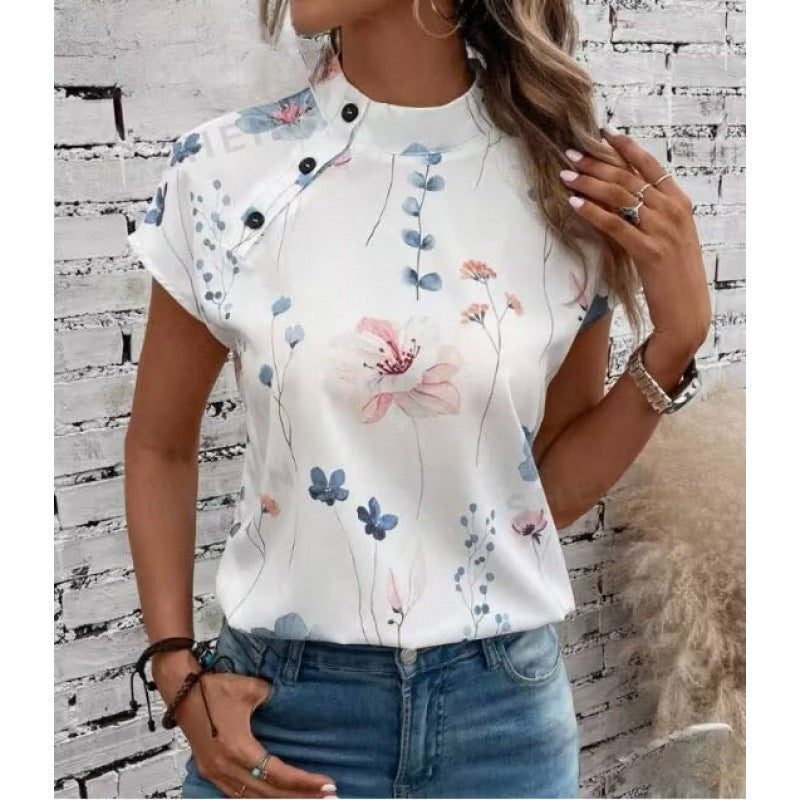 Damebluse med floraltryk og knapdetalje med korte ærmer Stilla