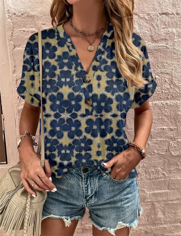 Damebluse med blomsterdesign og knaplukning Stilla