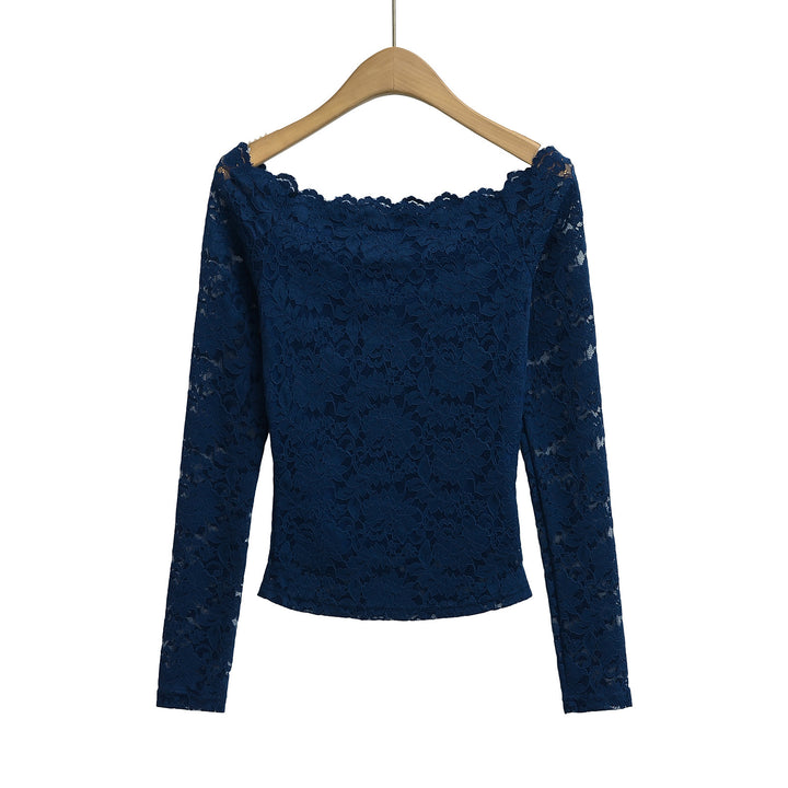 Dame spids top med flot off-shoulder look og sarte flæsedetaljer Stilla