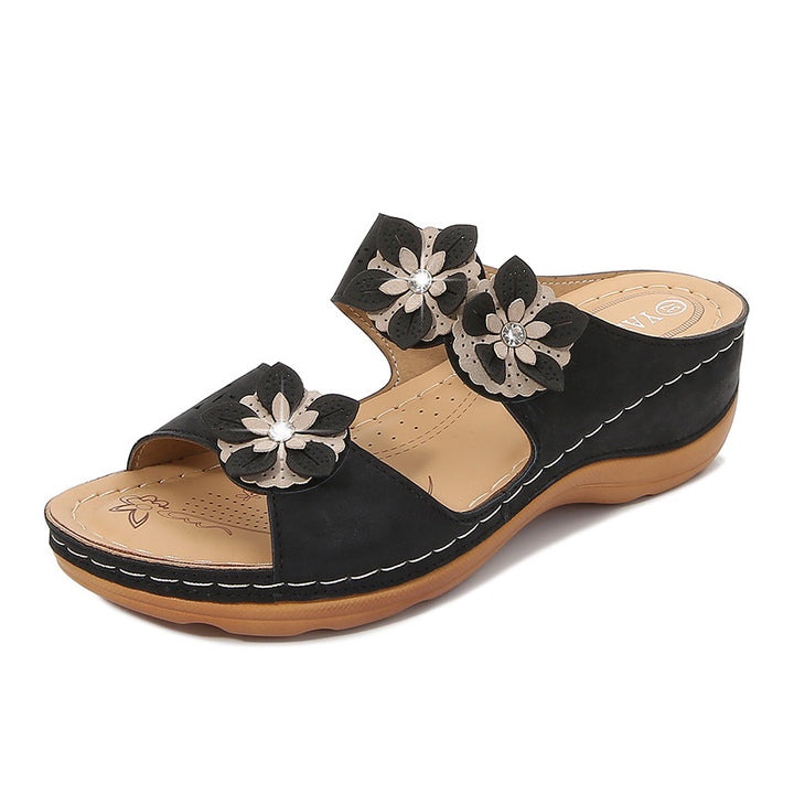 Dame pantoletten med florale accenter og ergonomisk design Stilla