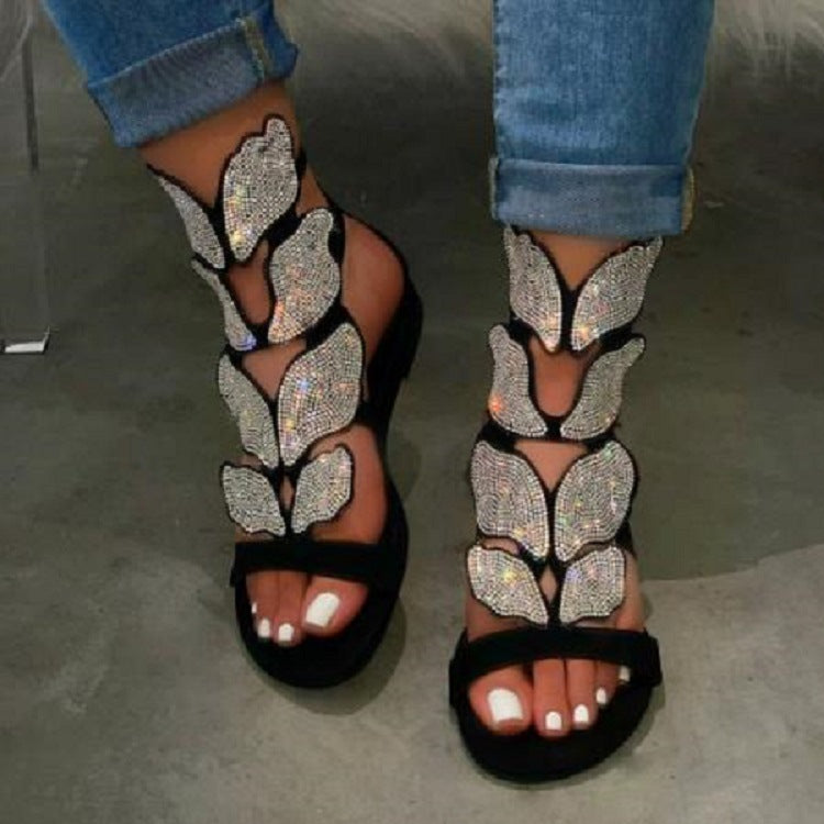 Dame Glitrende Sandaler med blomsterdesign og elegant rem Stilla