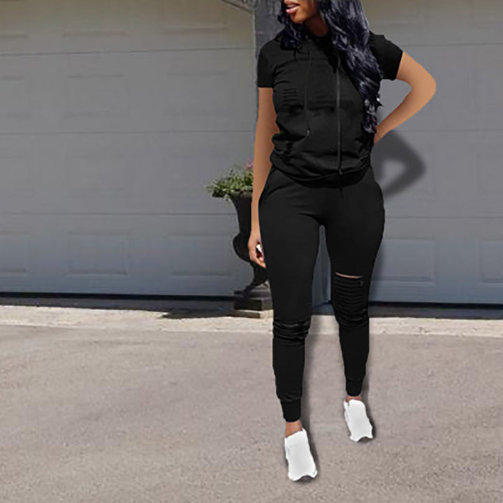 Dame joggingdragt med stilfulde lynlåsdetaljer og sporty pasform Stilla