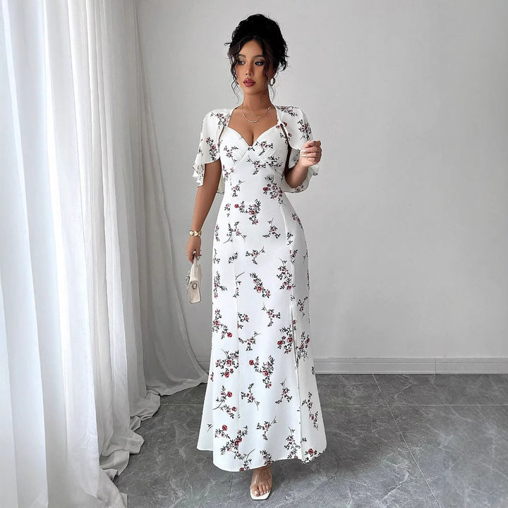 Dame maxikjole med elegante vinger og blomsterdesign Stilla