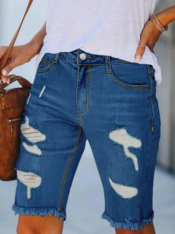 Dame stilfulde denim-shorts med modische destroyed-detaljer og fransede kanter Stilla
