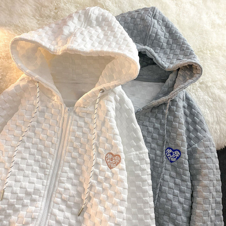 Dame hoodie jakke lavet af struktureret materiale med praktiske lommer og fashionable design