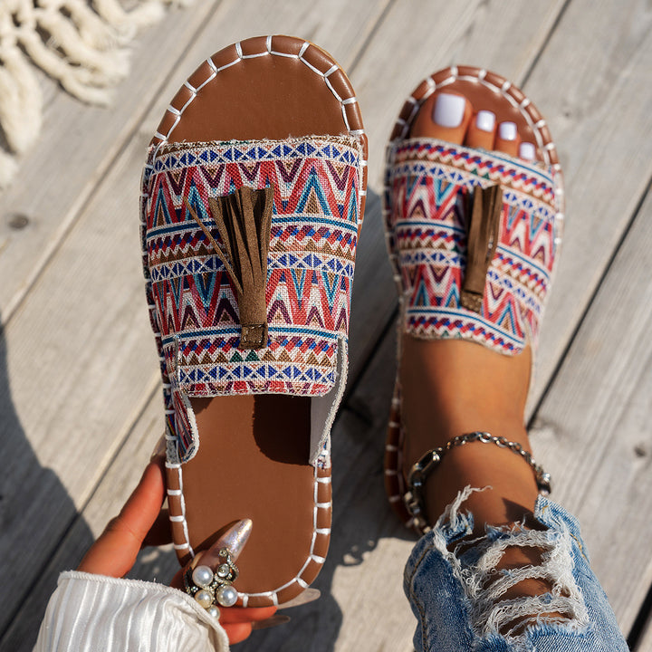 Dame slide-sandaler med farverigt vævdesign og fashionable kvaster Stilla