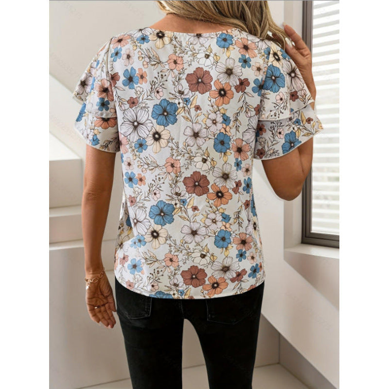 Dame kortærmet bluse med flæser og blomsterprint Skovae