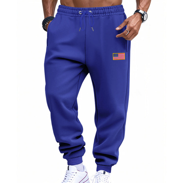 Herrer nan slank sweatpants med konisk hængende ben, elastisk tunneltræk og diskret flagapplikation Skovae