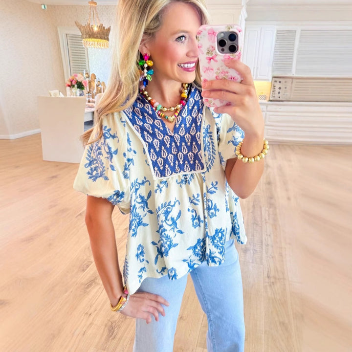 Dame legende skåret bluse skjorte med blomstret design og unikt krave Stilla