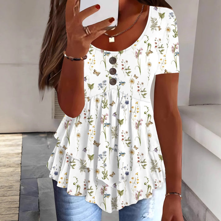 Damebluse med floralt flæsedesign og knapdetaljering Stilla