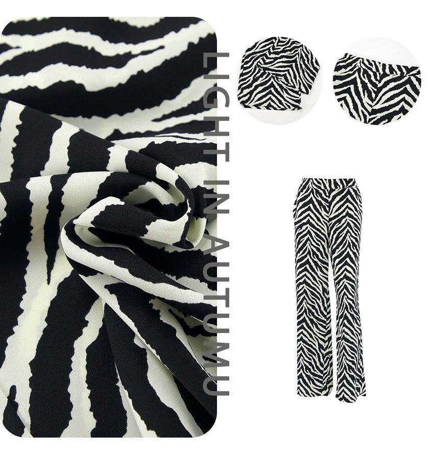 Dame bred Zebra-print Palazzo-bukser med elastisk talje og elegant snit Stilla