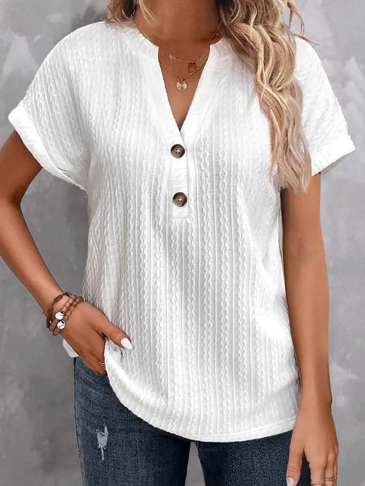 Damebluse med knapdetaljer og struktureret design Stilla