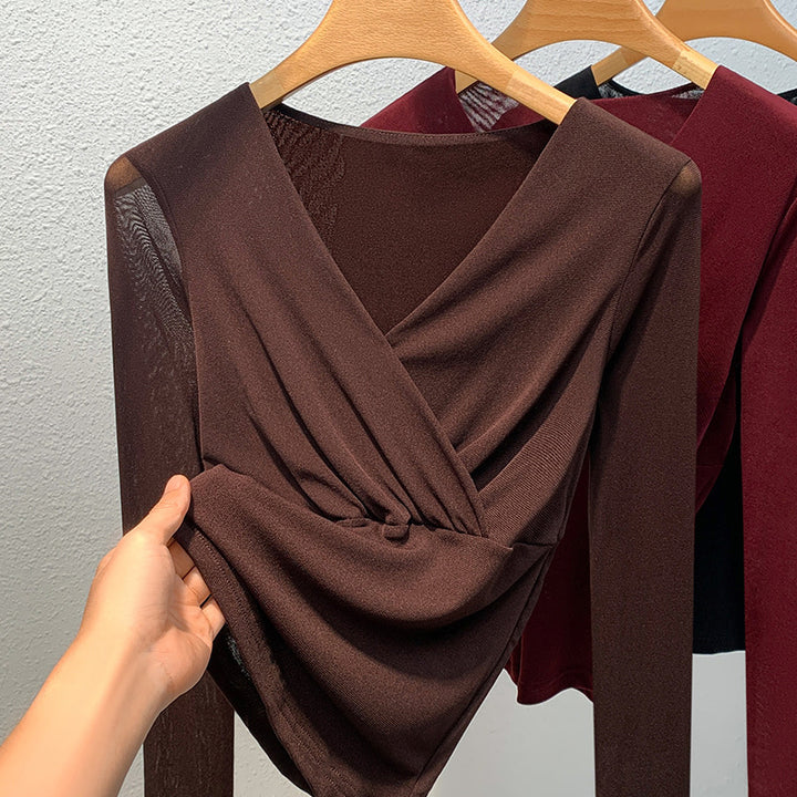 Dame elegant indpakningsbluse lavet af flydende materiale med raffinerede draperingsdetaljer Stilla