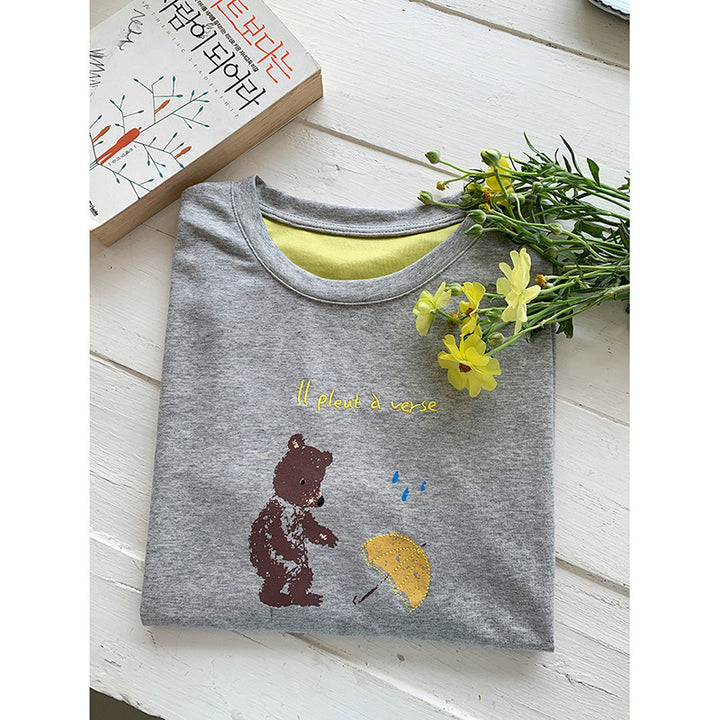 Dame afslappet T-shirt med farverig grafisk tryk og kontrasterende ærmer Stilla