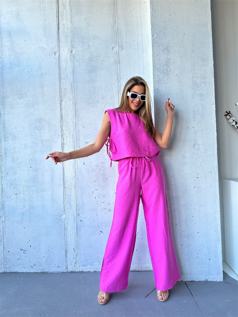 Kvinders bredbenede jumpsuit med lagdelt top og snøre Skovae