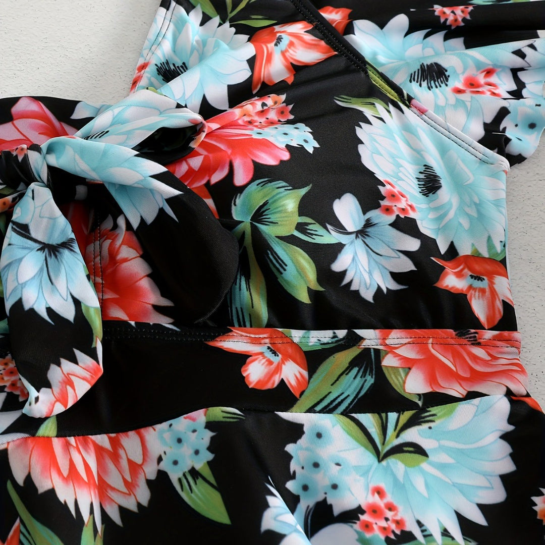 Dame én-delt badedragt med ruffledetails og blomstret design Skovae