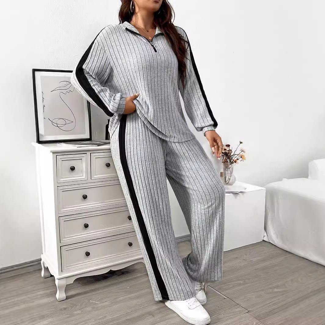 Dame elegant sportdragt med lynlås og stribet design Stilla