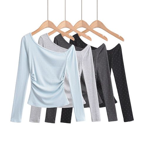 Dame asymmetrisk longsleeve-top med elegant ruffle-design og figurformende snit Stilla