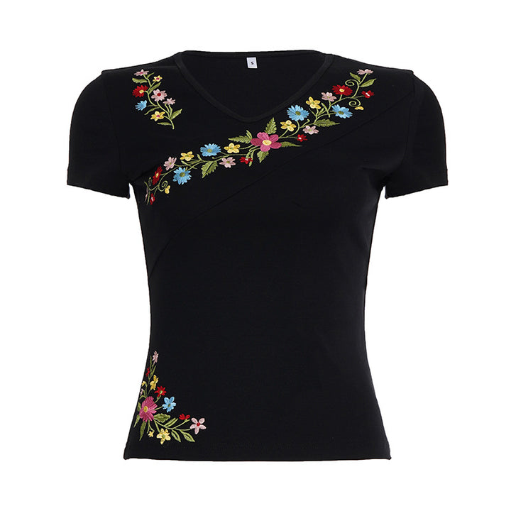 Damebluse med blomstret broderi og tætsiddende snit Skovae