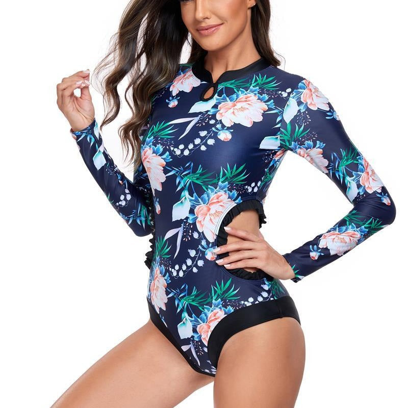 Dame elegant one-piece surfedragt med blomstermønster og cut-out-detaljer Stilla