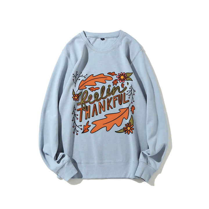 Kvinders sweatshirt med farverigt efterårsdesign og inspirerende tekst Stilla