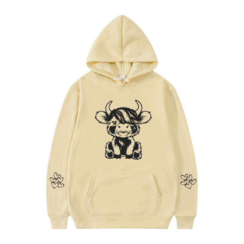 Kvindernes hætte sweatshirt med charmerende kvægmotiv og praktiske kængurulommer Skovae