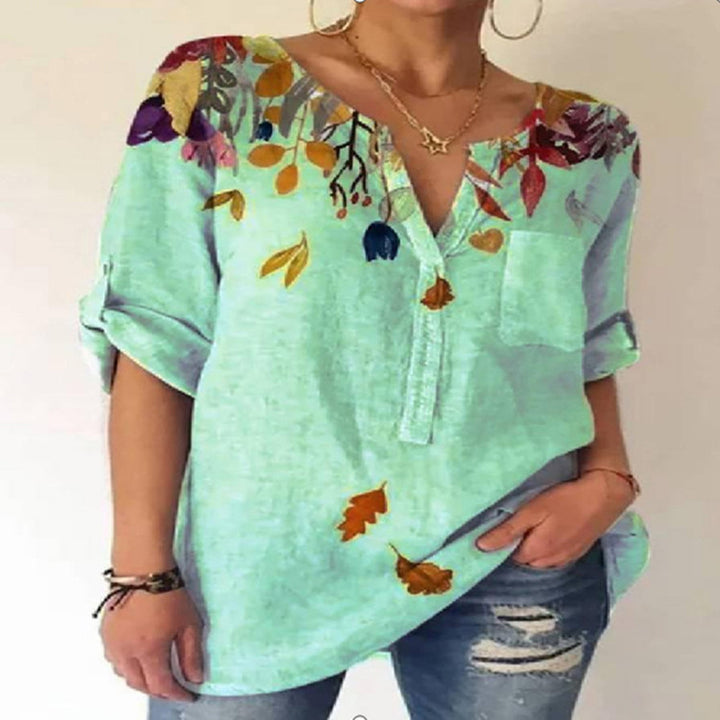 Damebluse med floral broderedesign og V-hals Stilla