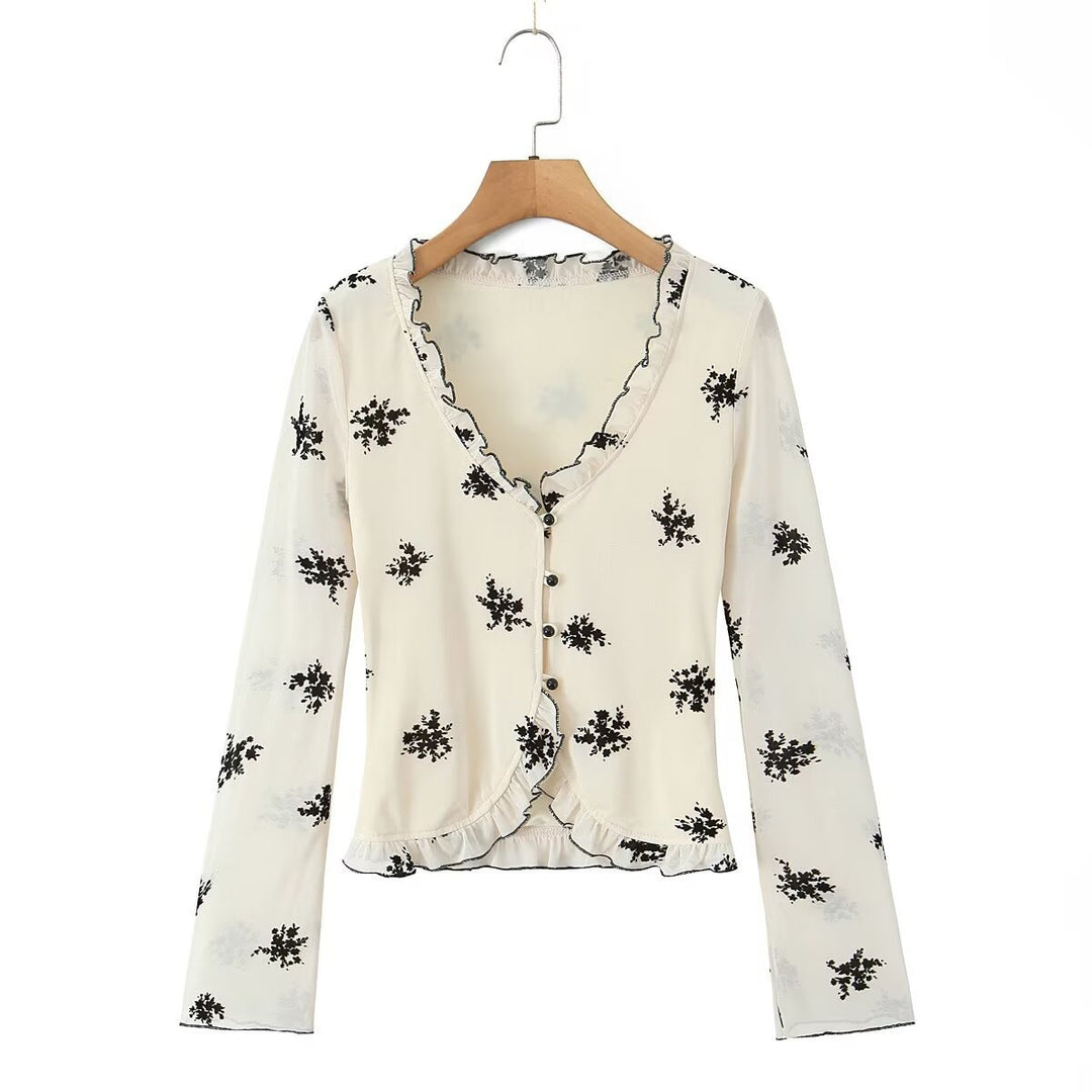 Damebluse med blomstret design og flæsedetaljer Stilla