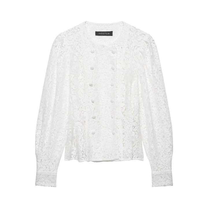 Dame spidsbluse med dekorative knapper og elegant pasform Skovae