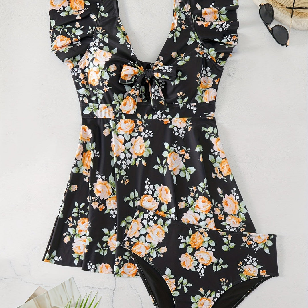 Dame én-delt badedragt med ruffledetails og blomstret design Skovae