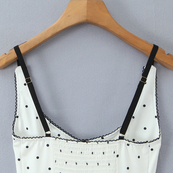 Dameoverdel med elegant polka-dot-look og fine detaljer Skovae