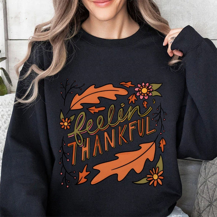 Kvinders sweatshirt med farverigt efterårsdesign og inspirerende tekst Stilla