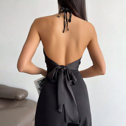 Dames elegant halterneck top med shiny stof og dekorativ knude Stilla