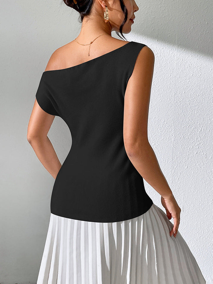 Skovae | Ensfarvet ærmeløs top med off-the-shoulder strikkedesign