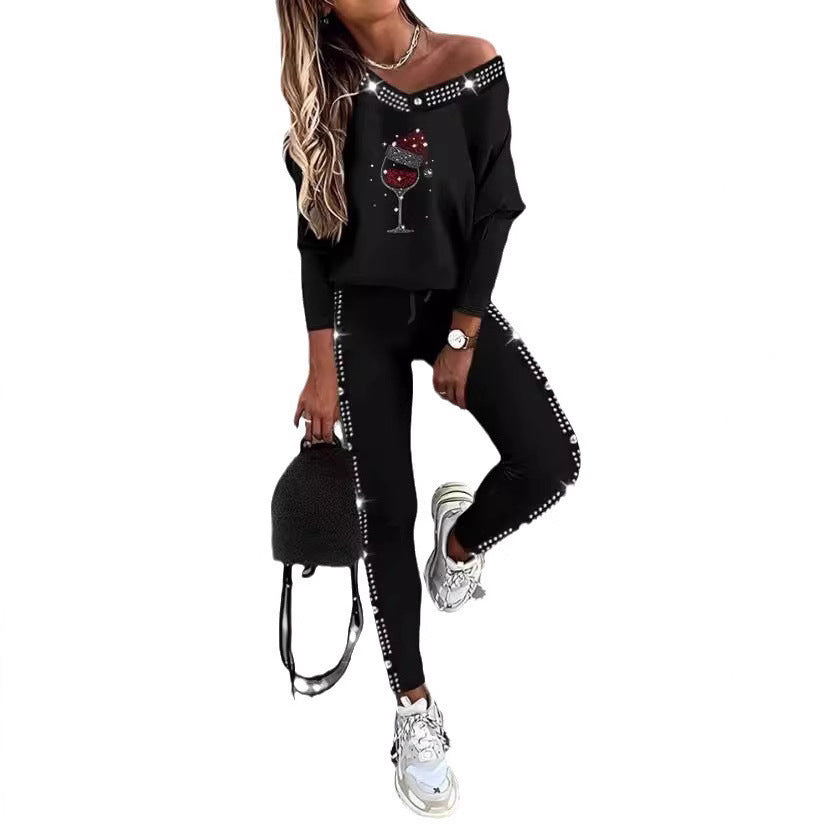 Dame sporty lounge sæt med off-shoulder top og glitrende detaljer Stilla