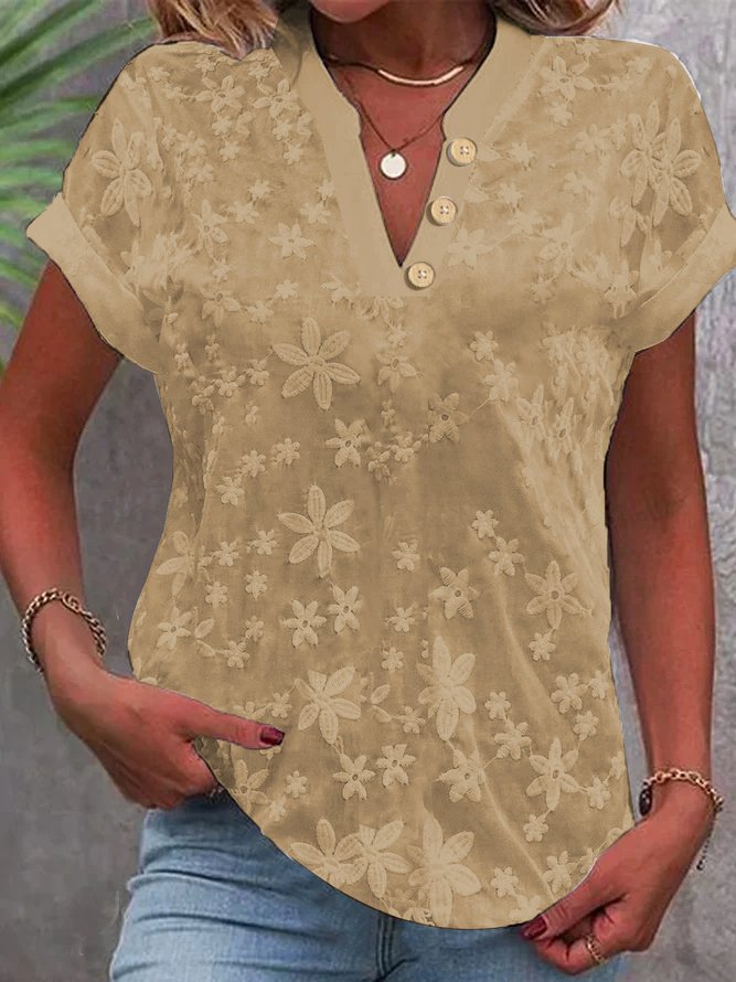 Damebluse med feminint blomsterbroderi-mønster Stilla