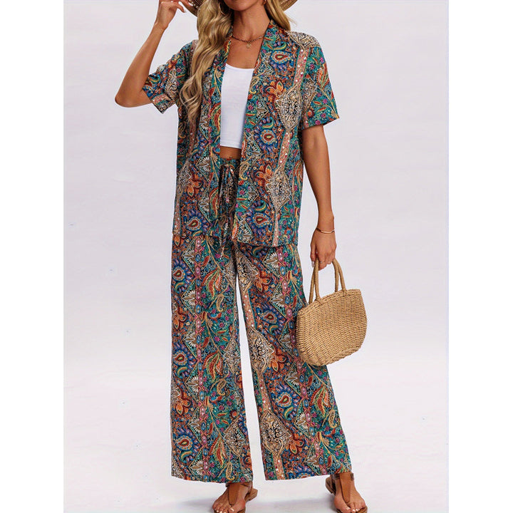 Dame kortærmet jumpsuit med flæse detaljer og bindebælte Skovae