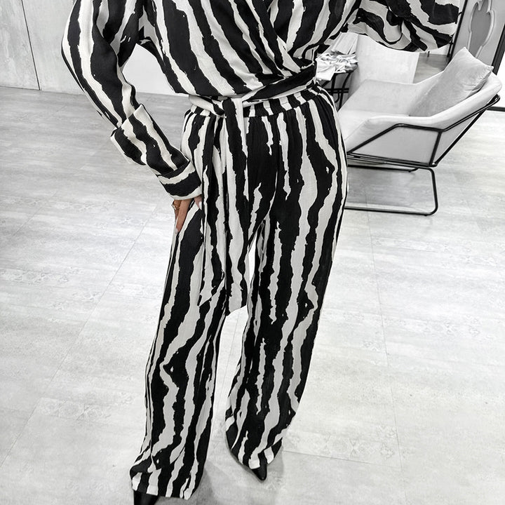 Dame jumpsuit med eksklusivt zebra-mønster og figursyet design Stilla