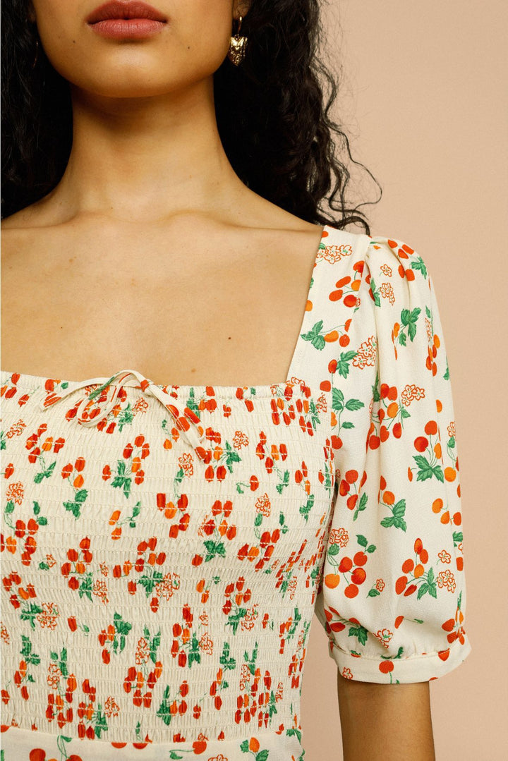 Dame midikjole med elastisk smockoberdel og blomsterdesign Stilla