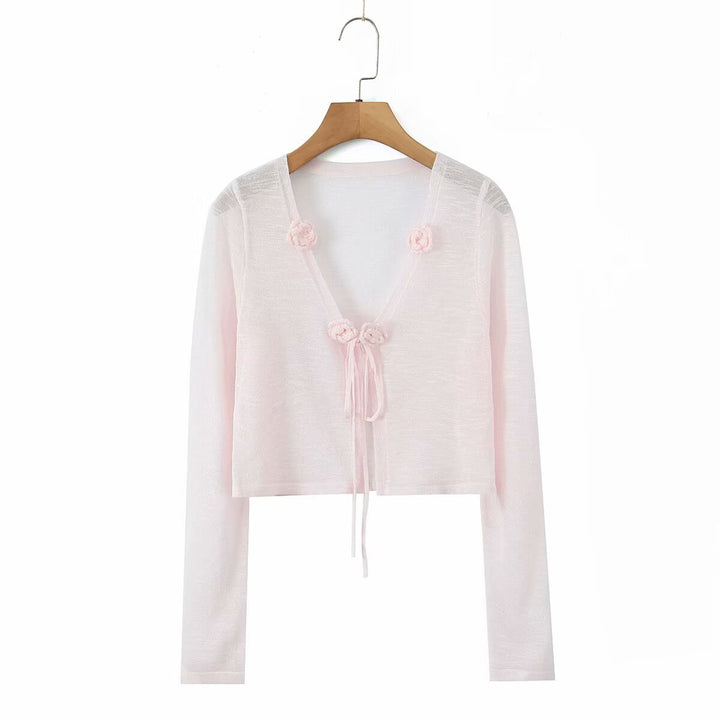 Dame cropped strikjakke med blomstrede accenter og elegant bindebånd Stilla