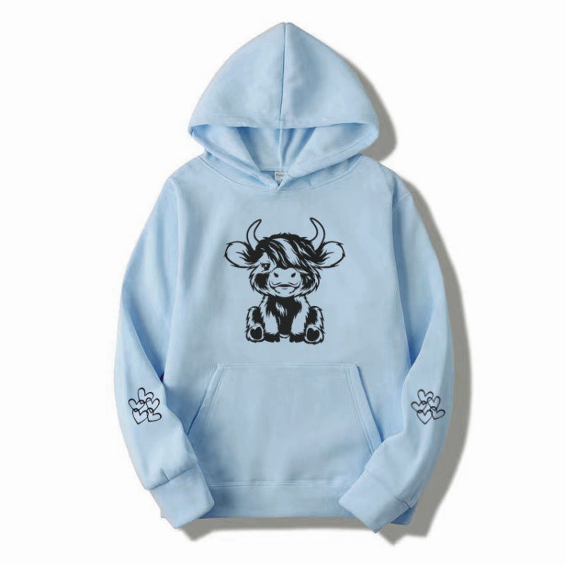 Kvindernes hætte sweatshirt med charmerende kvægmotiv og praktiske kængurulommer Skovae