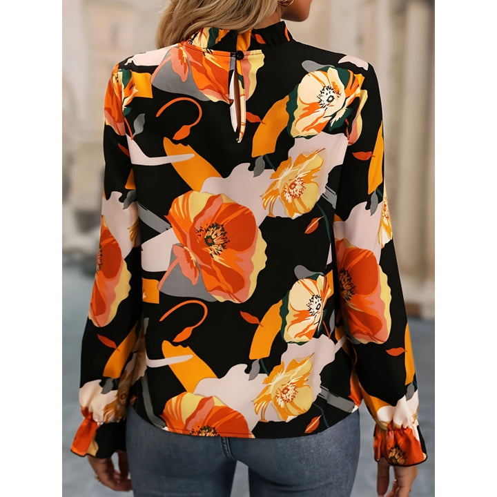 Damebluse med blomsterprint og flæseudskæring i lange ærmer Stilla