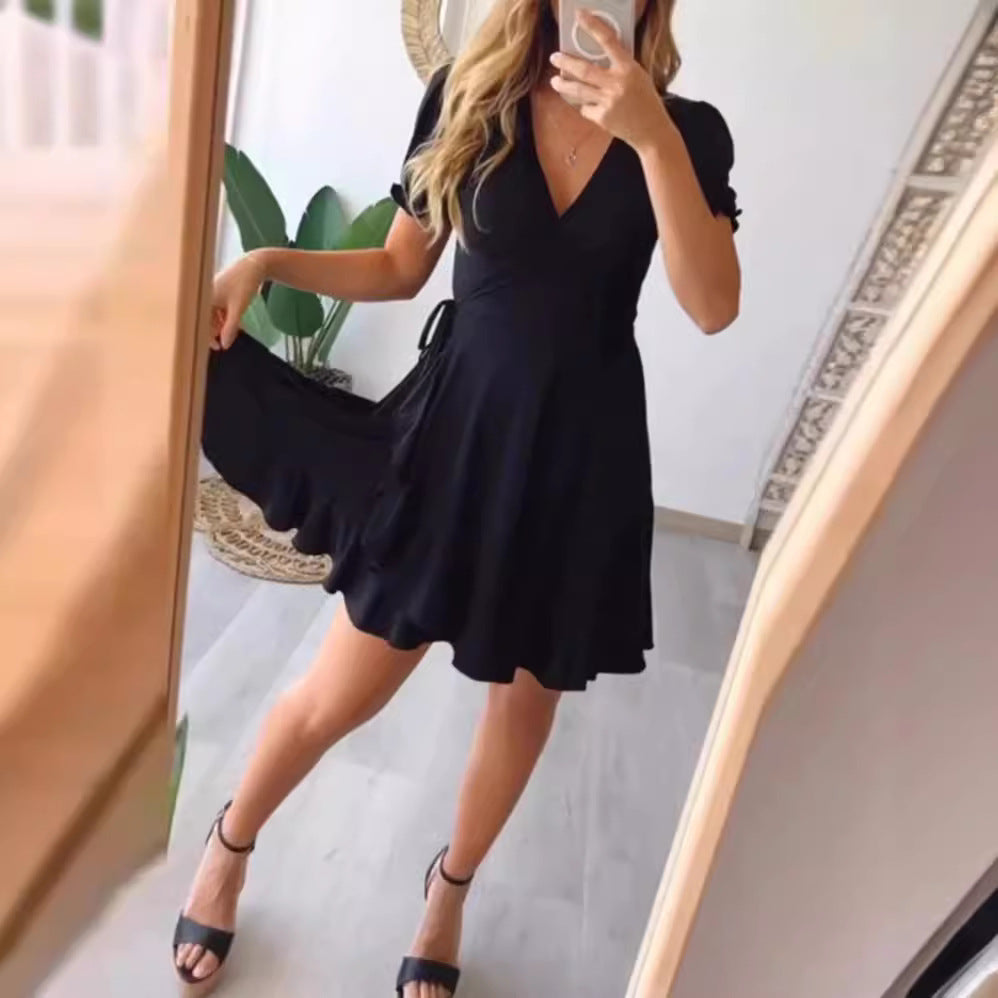 Dame wrapped dress med flydende skørt og elegante pufærmer Stilla